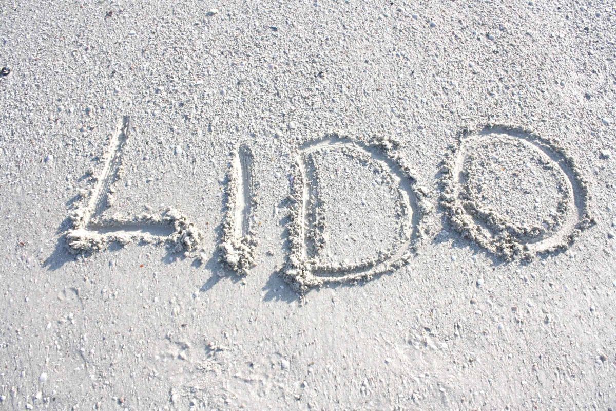 Lido written in the white sand of a Lido Key beach